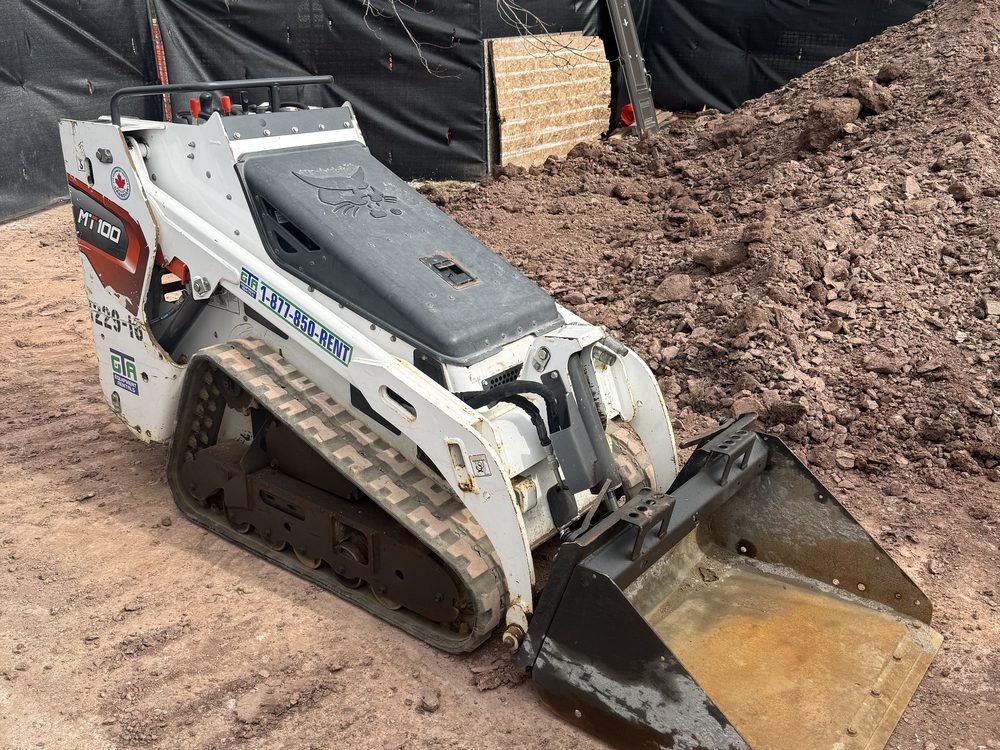 A Bobcat pushing dirt on a GTA site